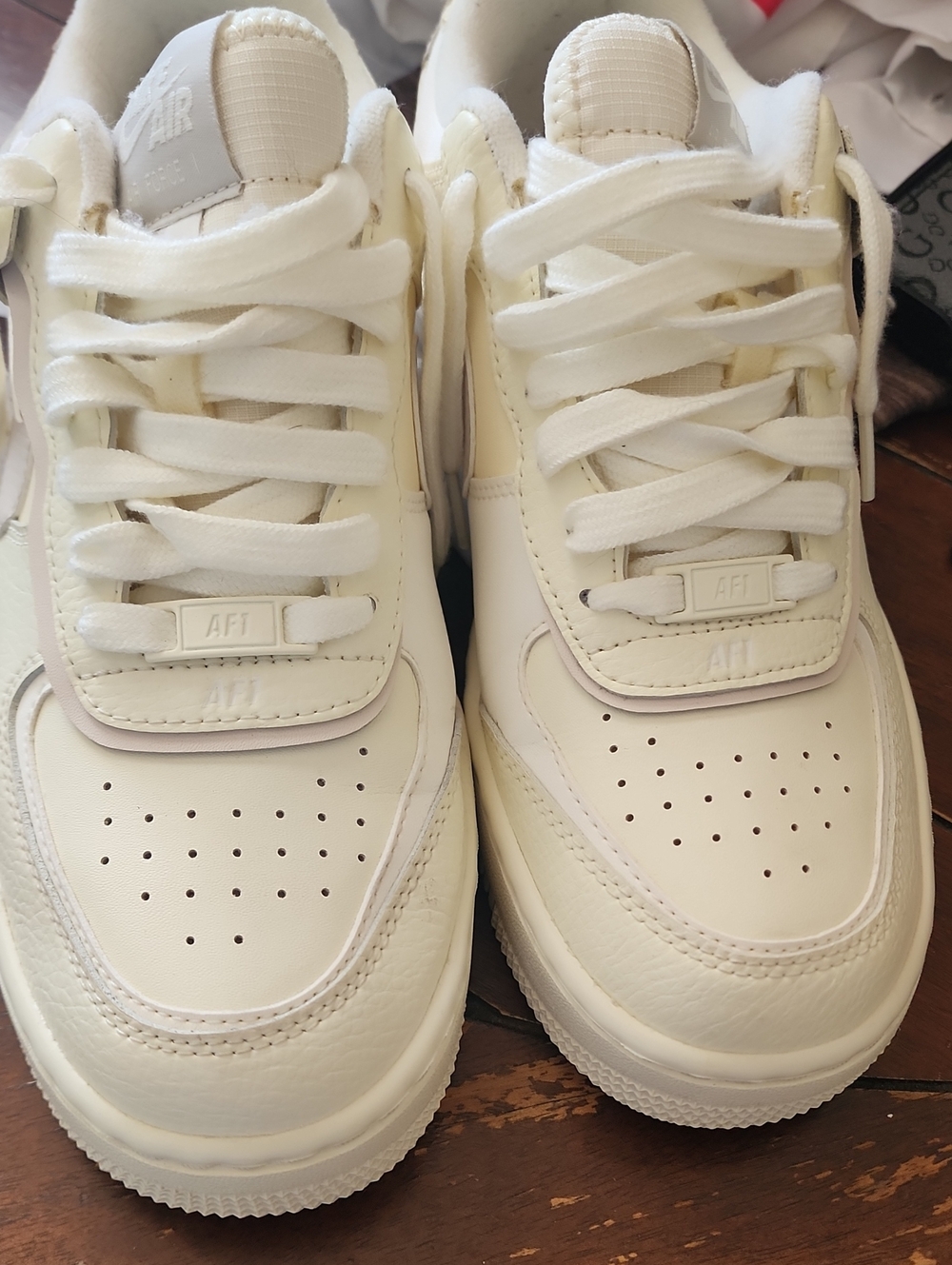 Nike Low-Top Leather Sneakers — White/Cream